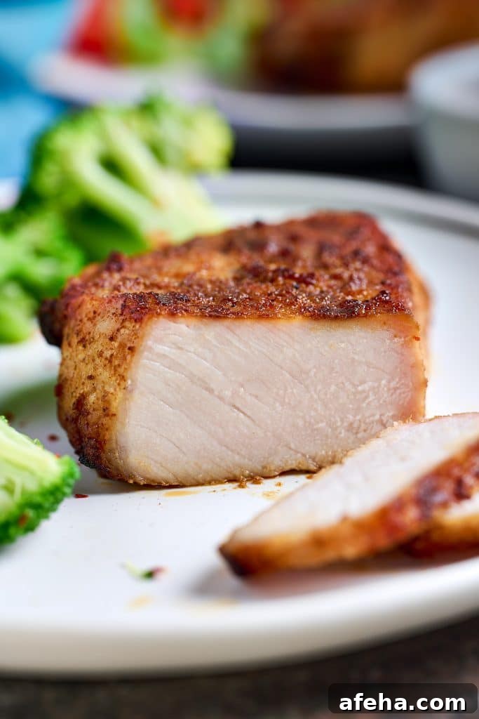 Perfectly juicy pork chop cut up to show doneness.