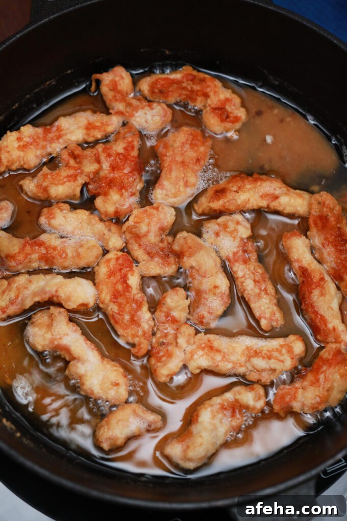 Frying chicken pieces.