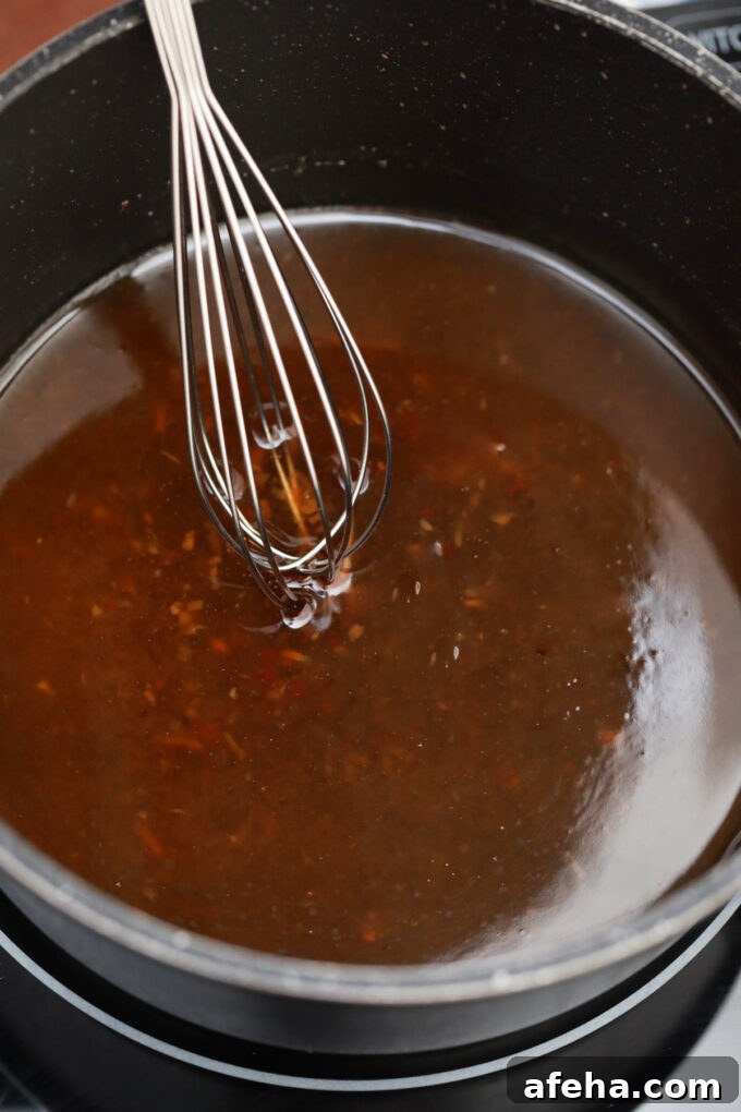 Making homemade honey sesame sauce.