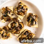 A top down view of a plate of mushroom bruschetta.