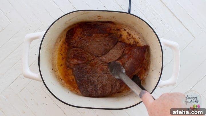 Birria Tacos with Rich Consommé: Where to Eat and How to Make Them 4 Searing the beef in an oven proof stock pot.