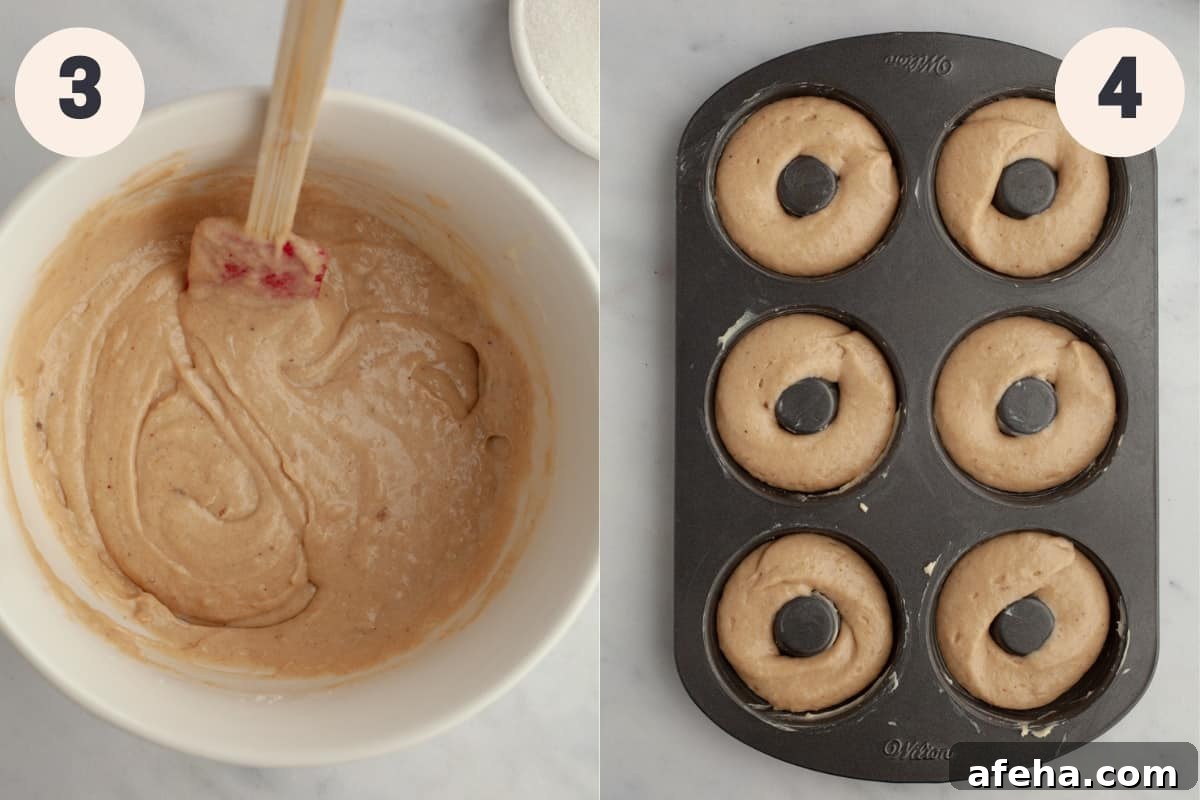 A bowl with donut batter in it and a donut pan with unbaked donuts.