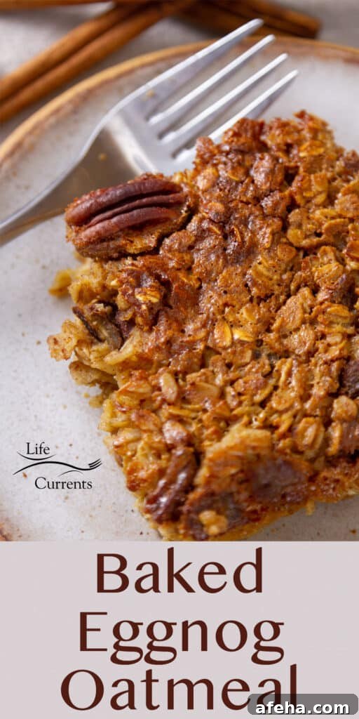 Looking down on a slice of baked eggnog oatmeal with a fork next to it.