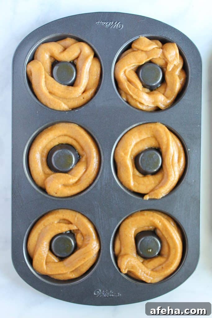 Spiced Gluten-Free Pumpkin Donuts: Soft Autumn Recipe 9 gluten free pumpkin donuts in a baking pan