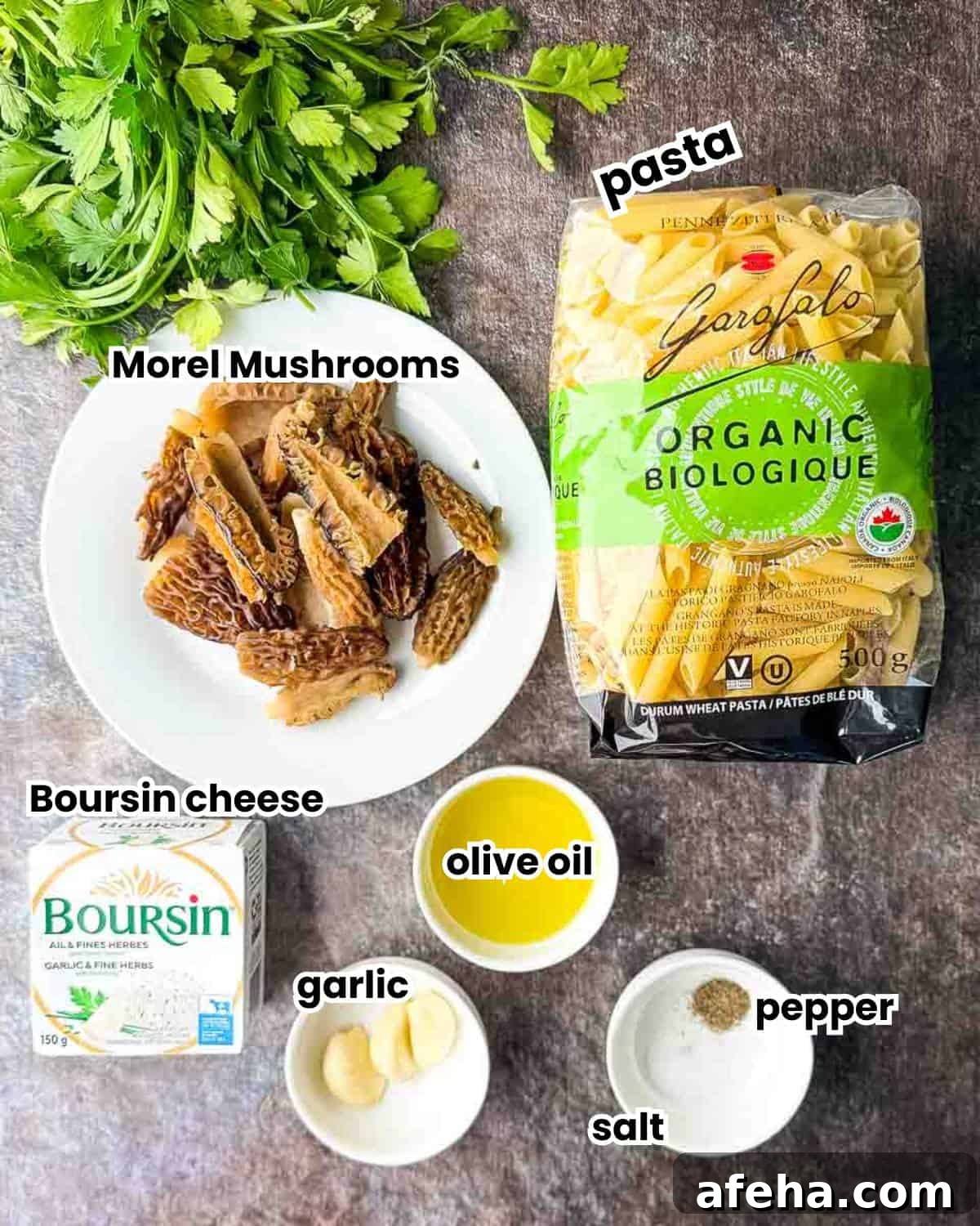 The labeled ingredients for Morel Mushroom Pasta with Boursin Cheese, including fresh morel mushrooms, pasta, garlic, Boursin cheese, olive oil, butter, salt, and pepper.