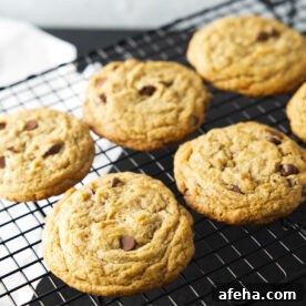 Cookies lined up on a wire rack to cool.