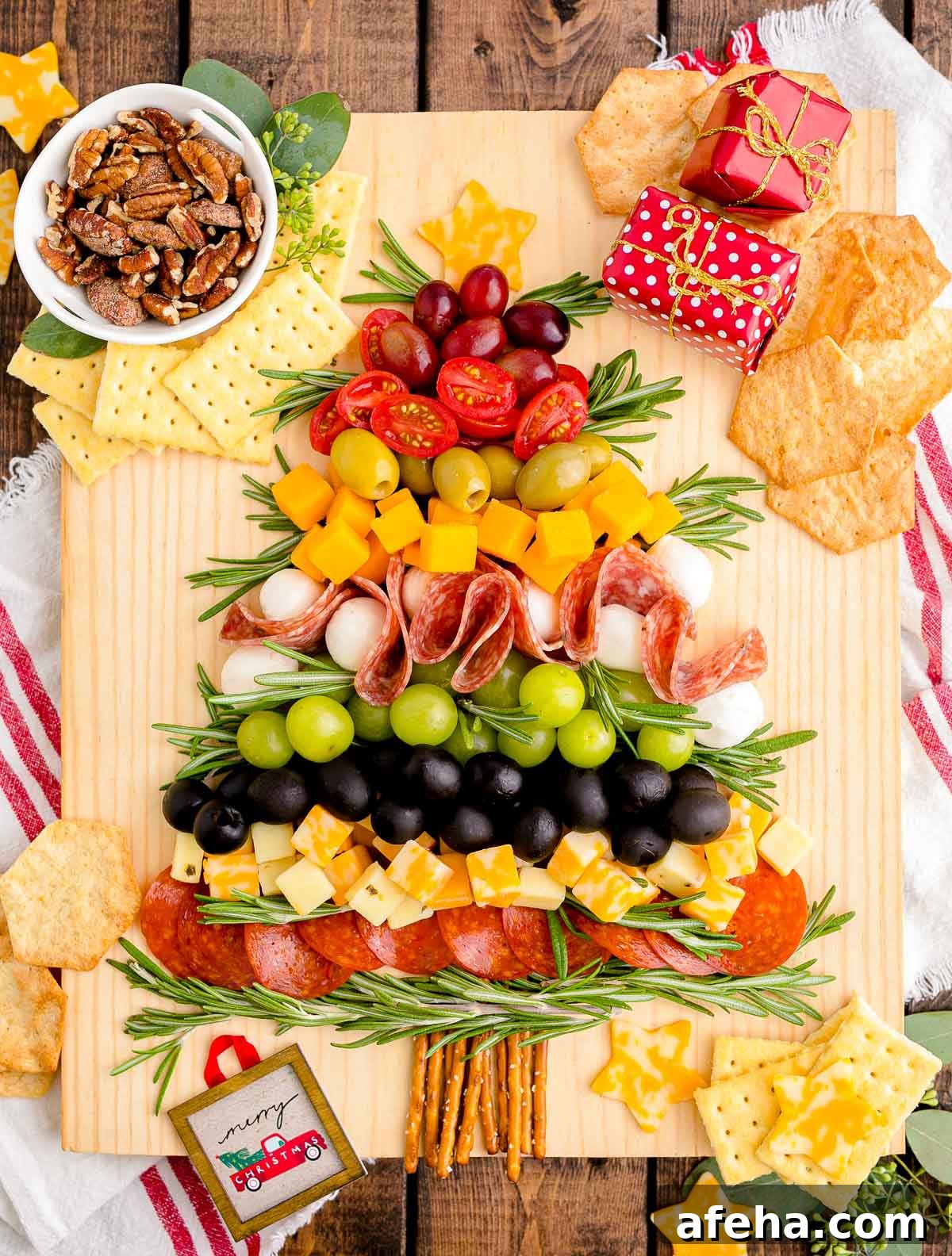 Overhead photo of a Christmas Tree Charcuterie board on a wooden table.
