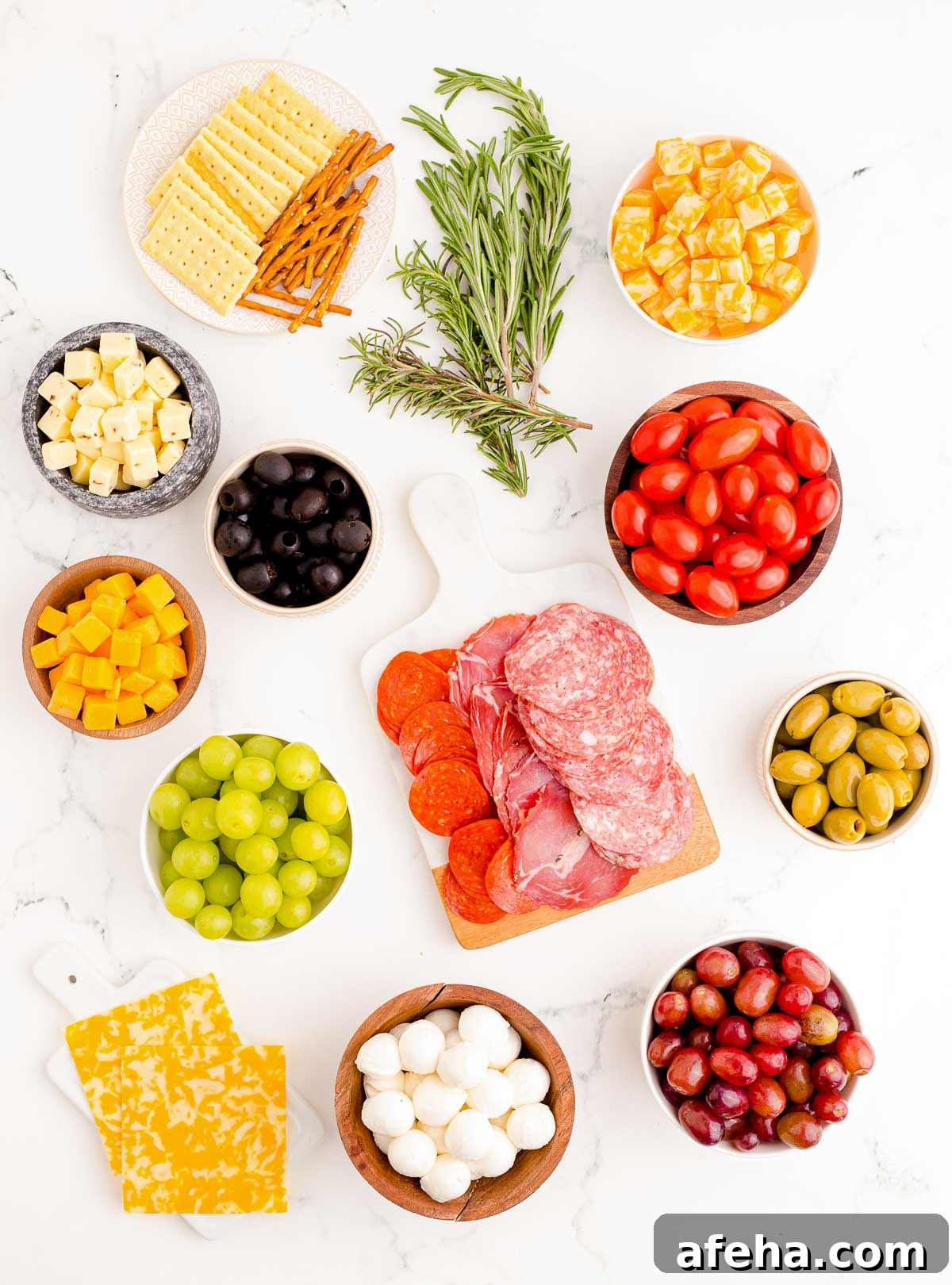 Overhead photo of ingredients used to make a Christmas Tree shaped charcuterie board.