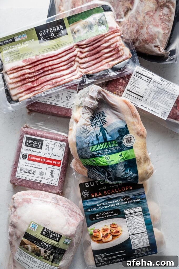 ButcherBox After 8 Years: 2026 Review and What’s New 2 Flatlay photo of ButcherBox products spread on a kitchen counter to accompany a comprehensive ButcherBox review.
