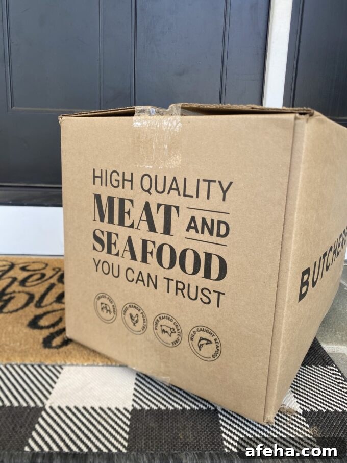 ButcherBox After 8 Years: 2026 Review and What’s New 3 Angled view of an unopened ButcherBox with the slogan, "High quality meat and seafood you can trust" clearly visible.