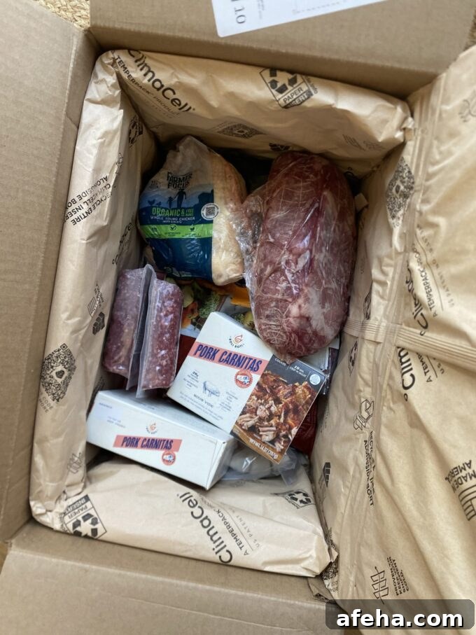 ButcherBox After 8 Years: 2026 Review and What’s New 5 Overhead view of a ButcherBox, just arrived and opened to show products inside.