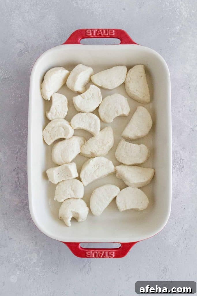 dough cut in half for meatball casserole