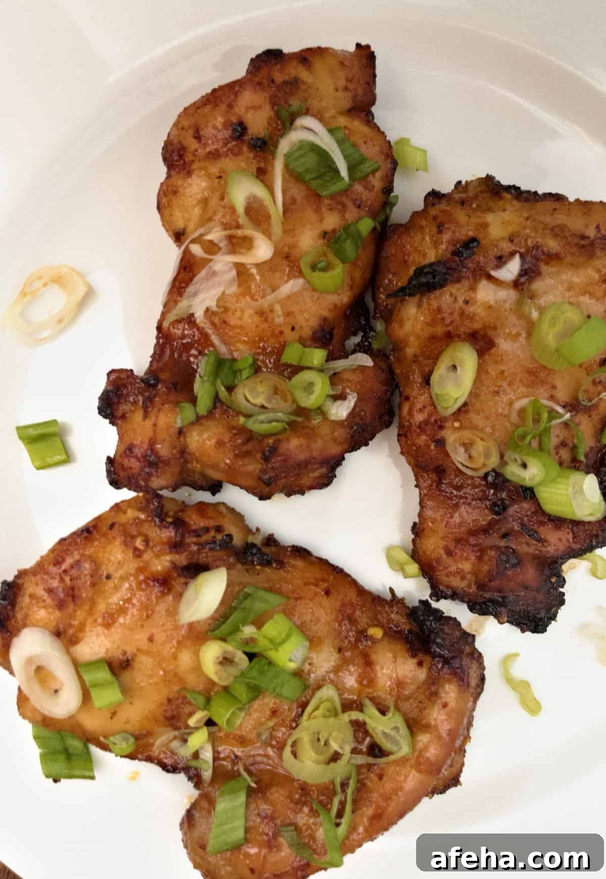 air fryer boneless chicken thighs finished on plate