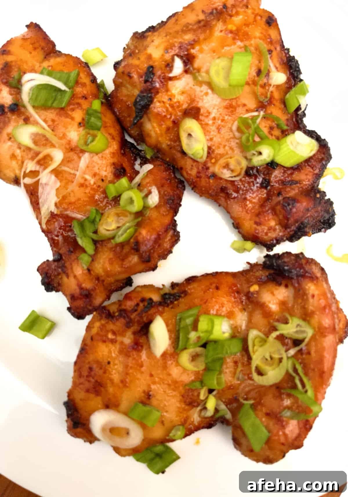 boneless chicken thighs on plate cooked in air fryer