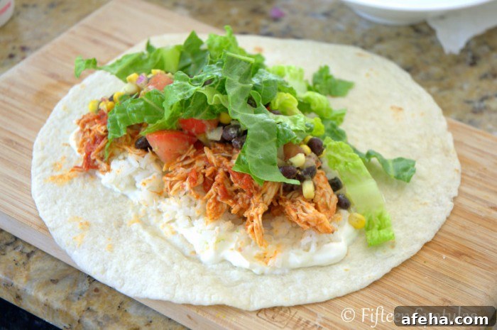 Shredded Chicken Burrito with Flour Tortilla, lettuce, and toppings
