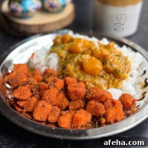 Delicious sweet potato curry served with crispy tofu and rice, inspired by Sakkaravalli Kizhangu por.