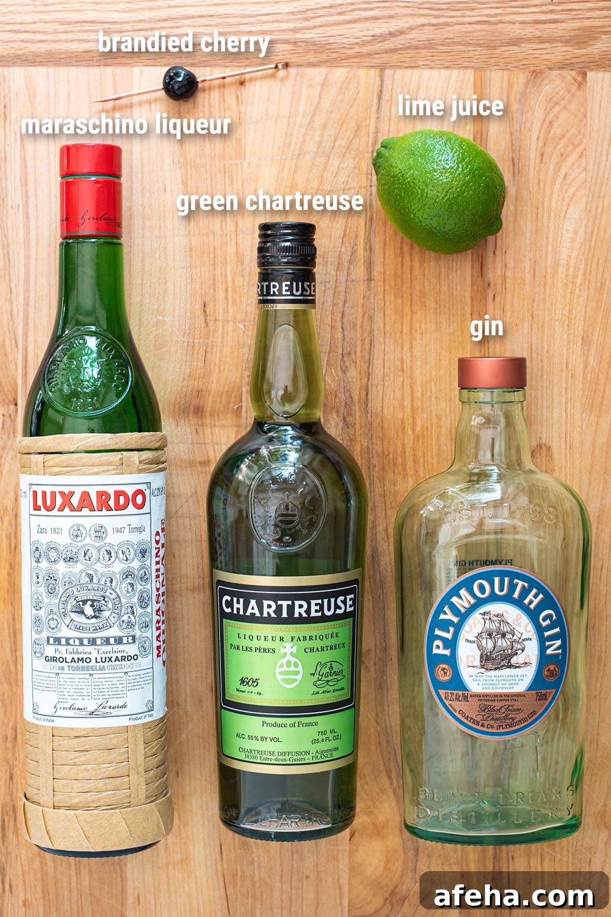 Ingredients to make a Last Word cocktail on a cutting board.