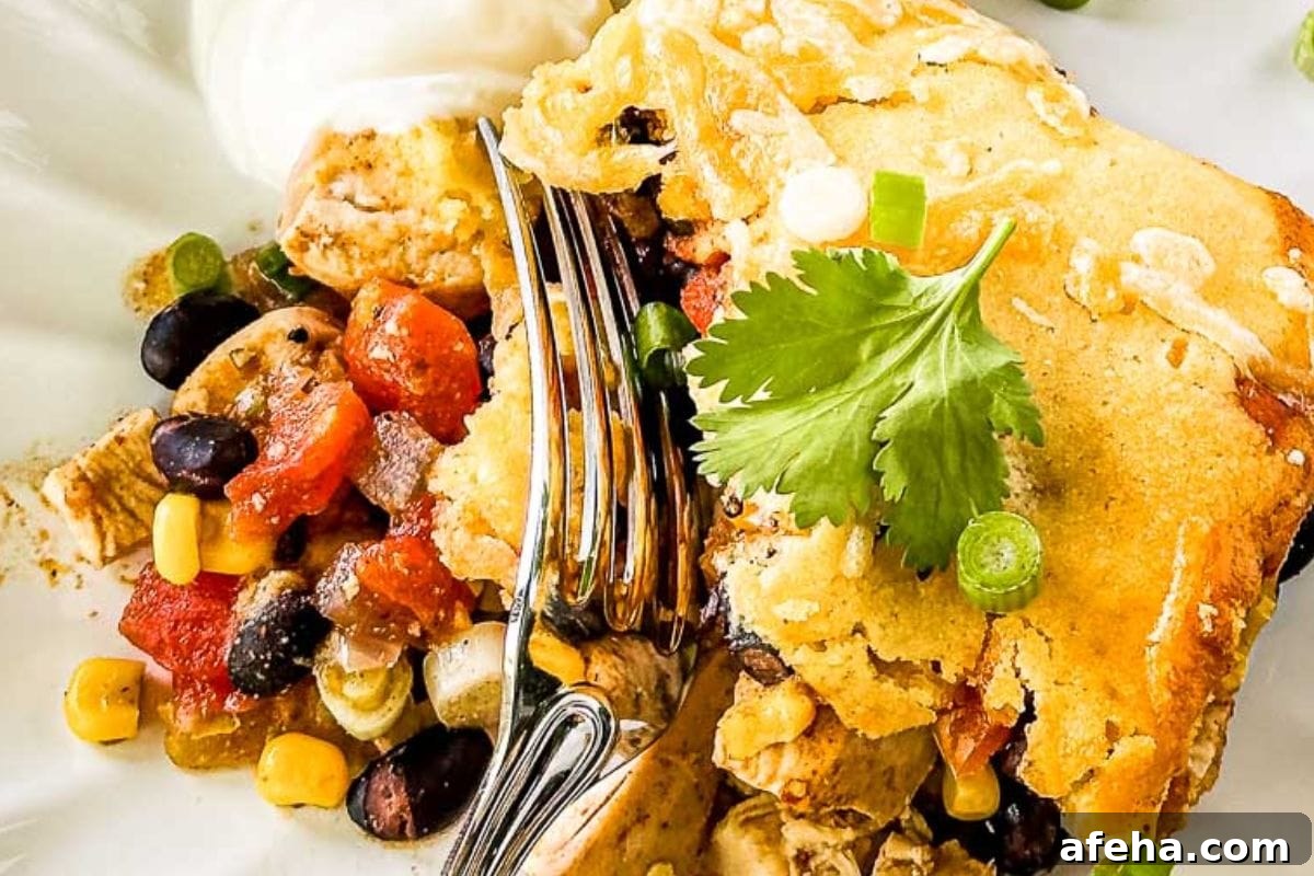 Chicken cornbread casserole served with black beans, corn, and cilantro.