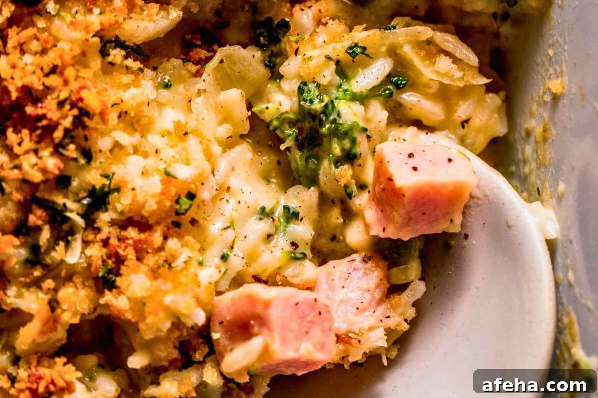 Creamy broccoli and ham casserole topped with crispy breadcrumbs.