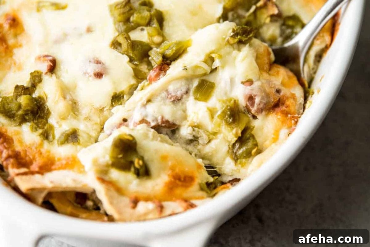 Creamy chicken casserole topped with melted cheese and green chiles.