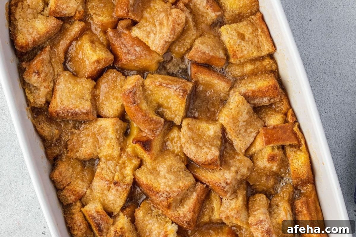 Golden-brown brioche French toast casserole in a baking dish.