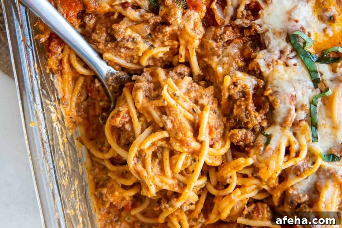 Hearty baked spaghetti with melted cheese and herbs.