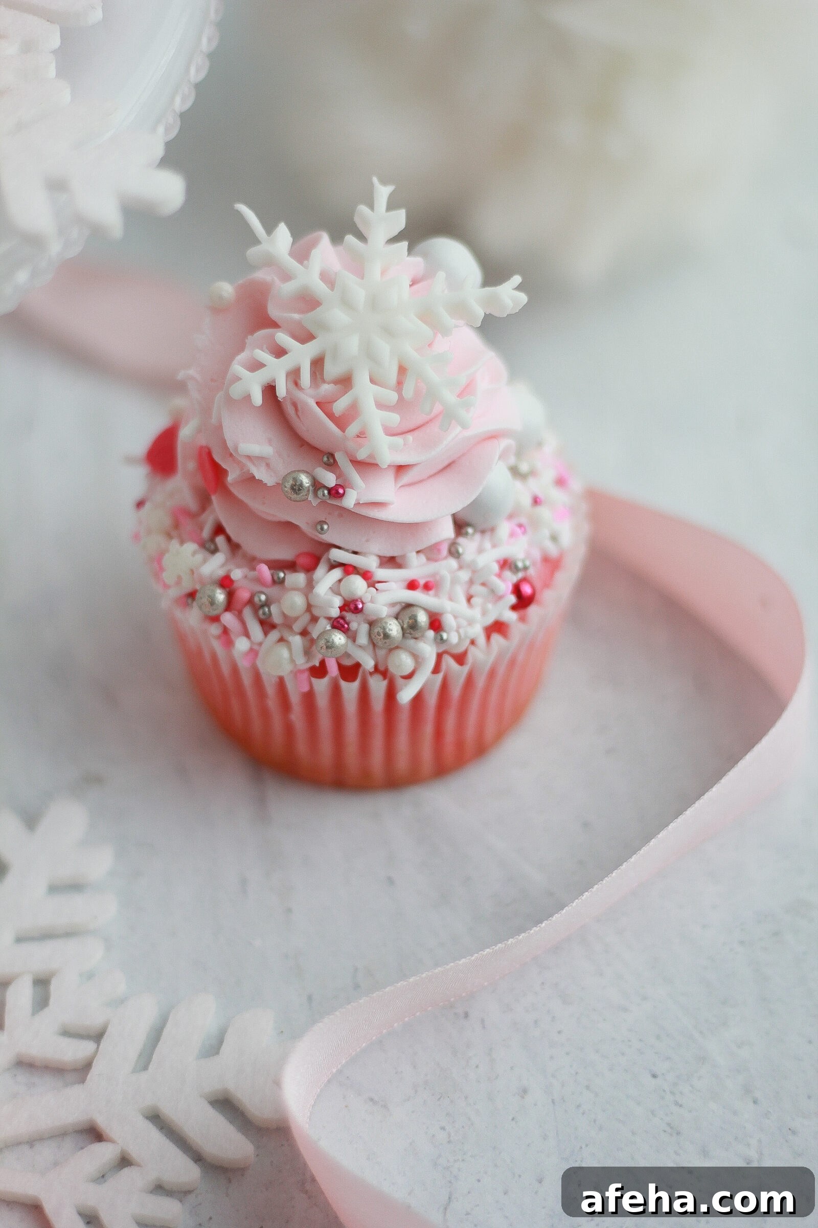 Pink Winter Wonderland Cupcakes: Festive Whipped Frosting Recipe 3 Pink cupcakes on a tray