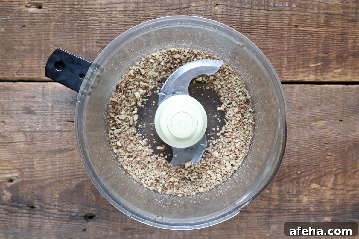 Praline-Crusted Candied Bacon — Sweet & Crunchy Bacon Recipe 6 chopped pecans in a food processor.