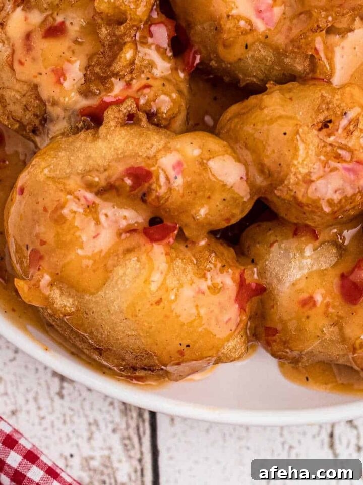 Close up of boom boom shrimp, or bang bang shrimp, on a plate.