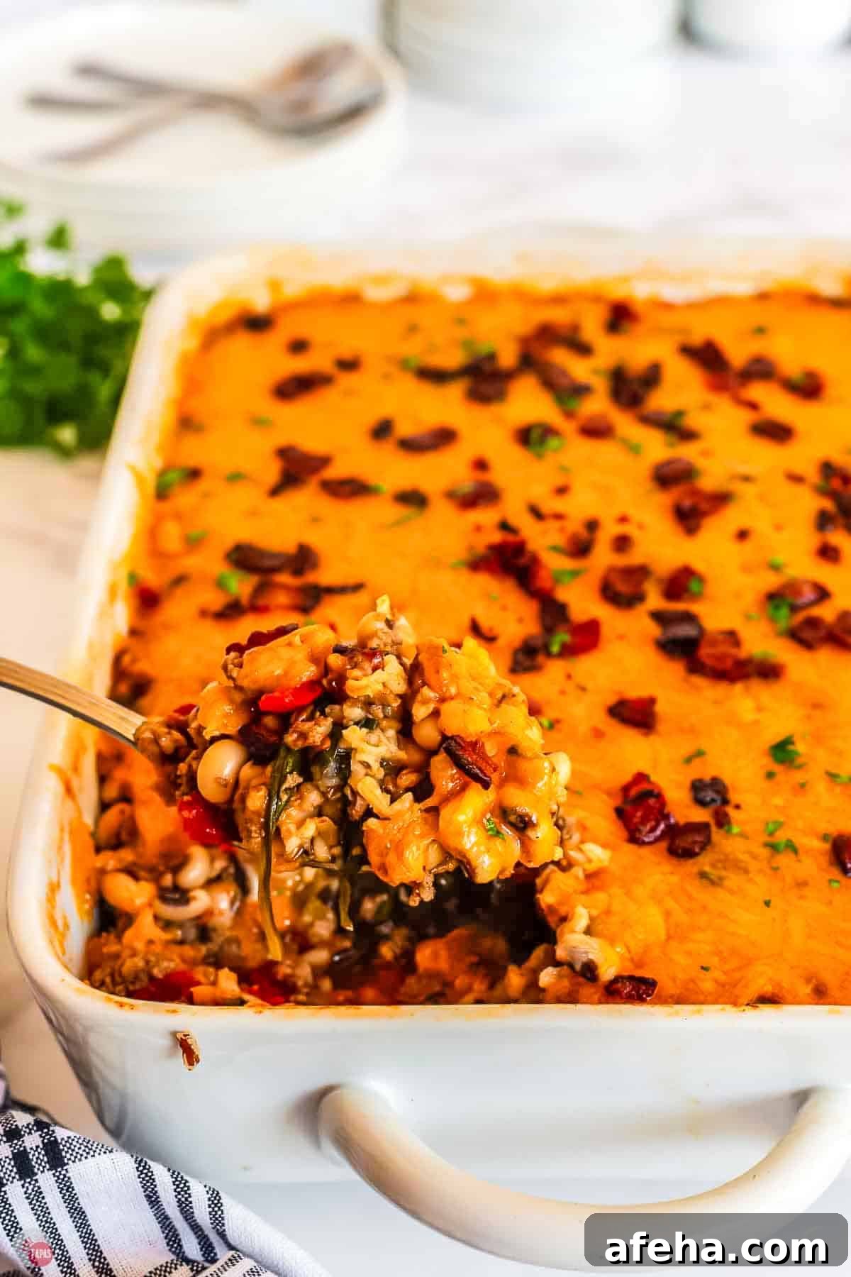 spoon scooping out casserole