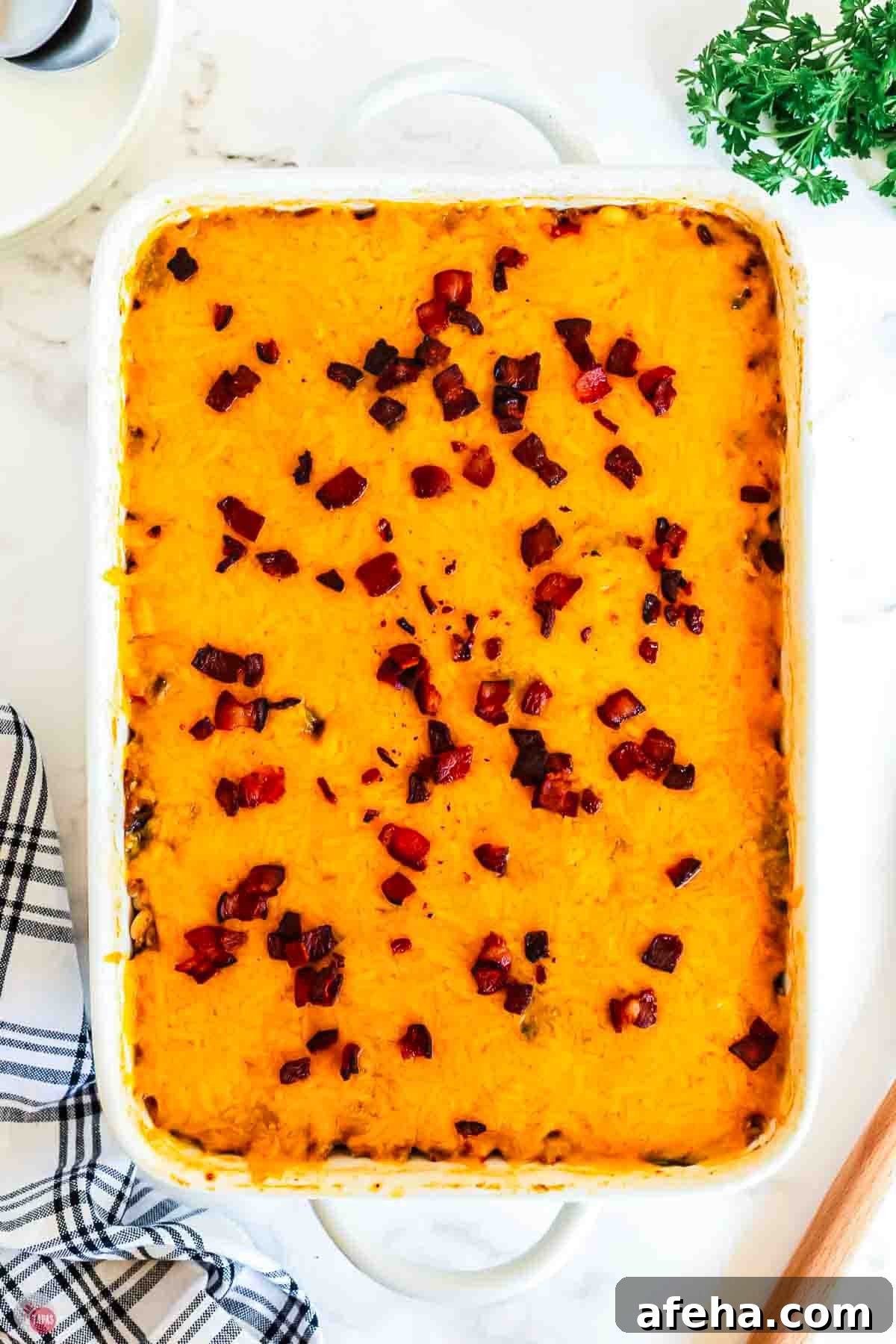 overhead picture of casserole topped with melted cheese and bacon
