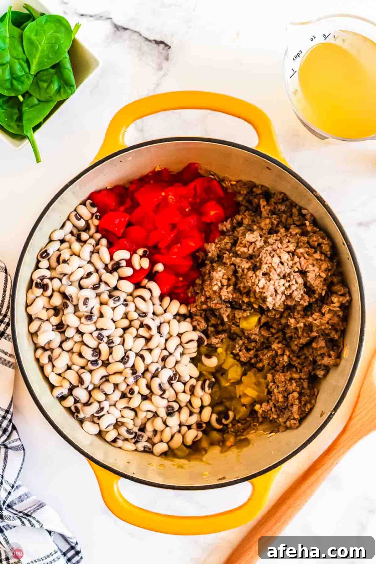 black eyed peas and ground pork in a pot