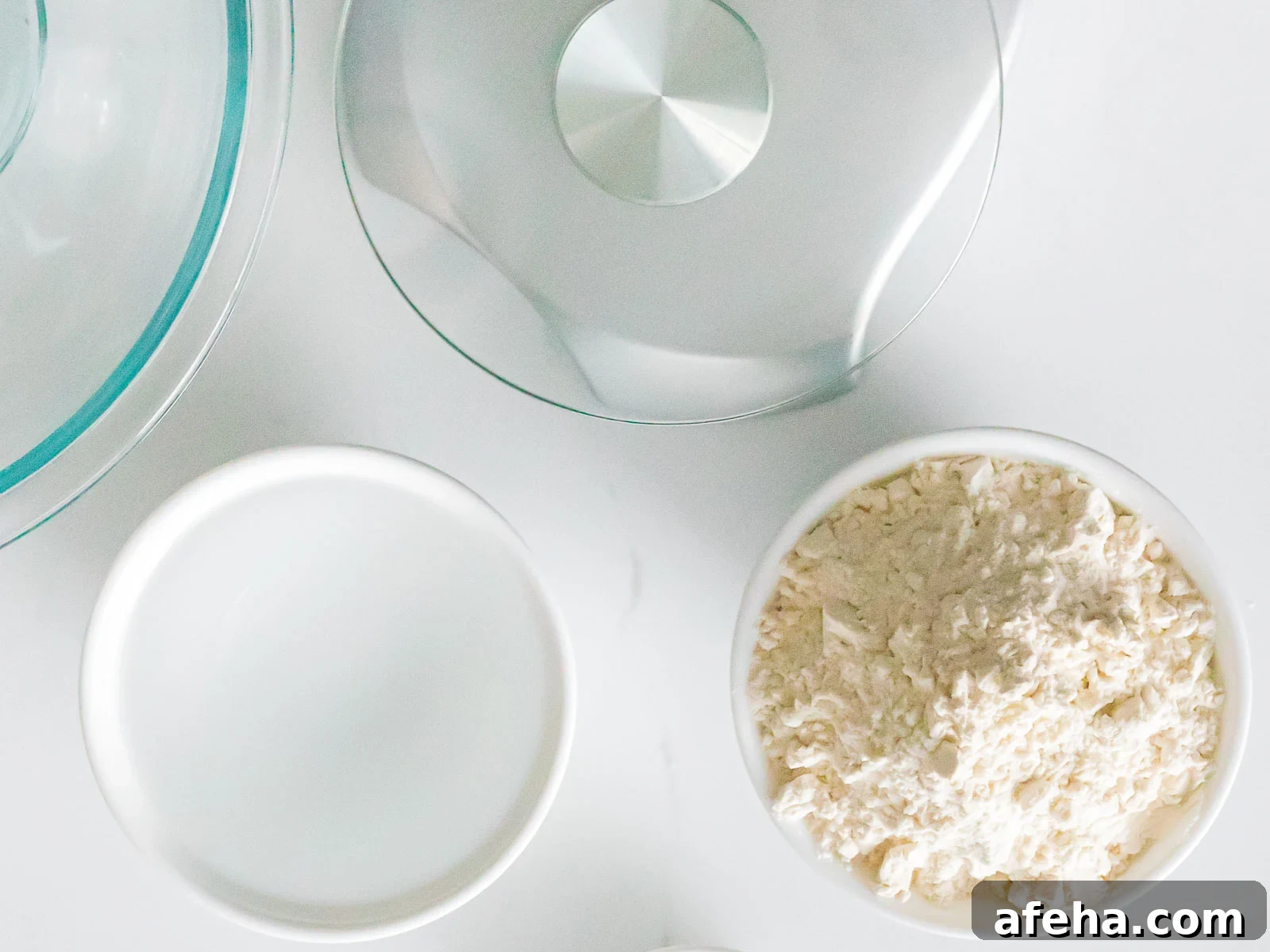 a bowl of flour, water, and kitchen scale