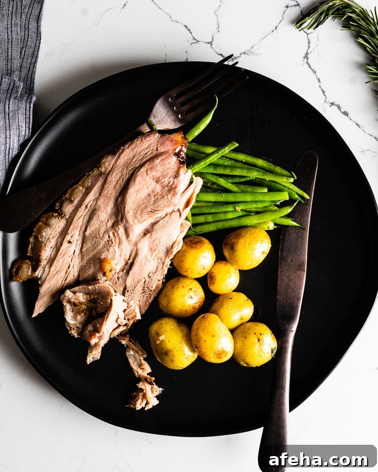 roast pork shoulder with potatoes and green beans