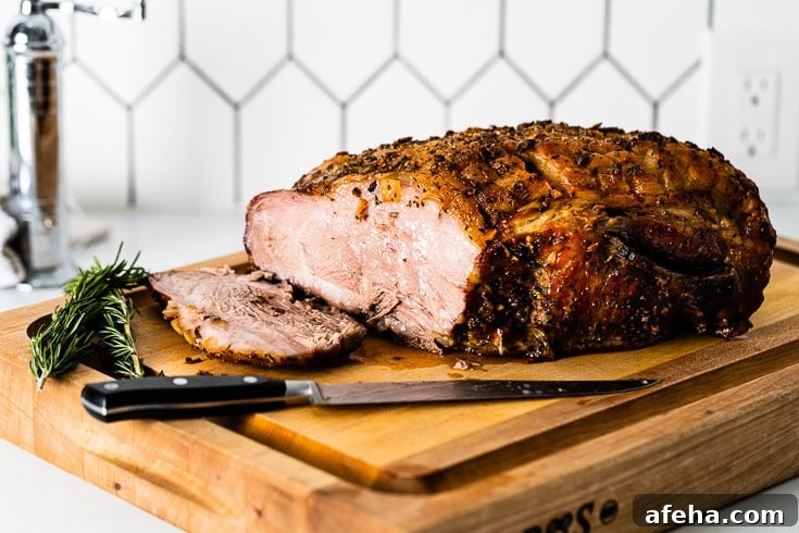 sliced roast pork shoulder on cutting board