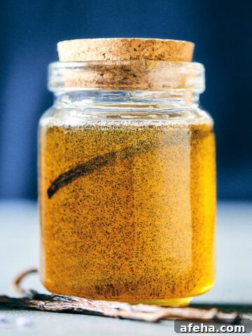 Vanilla infused honey with a spoon