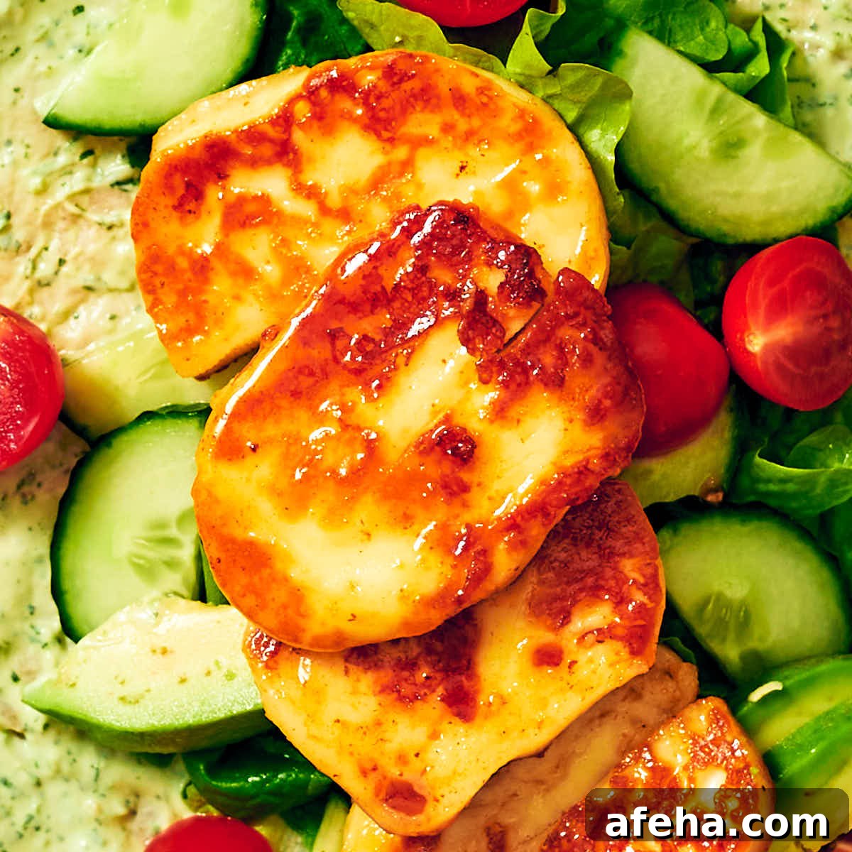 Seared Halloumi cheese glazed with hot honey in a wrap with vegetables.