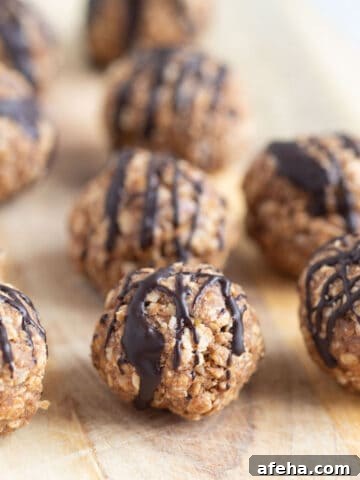 Vanilla protein balls on wooden board.