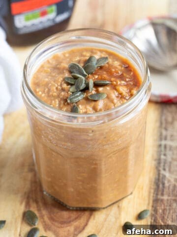 Pumpkin pie overnight oats in a glass jar.
