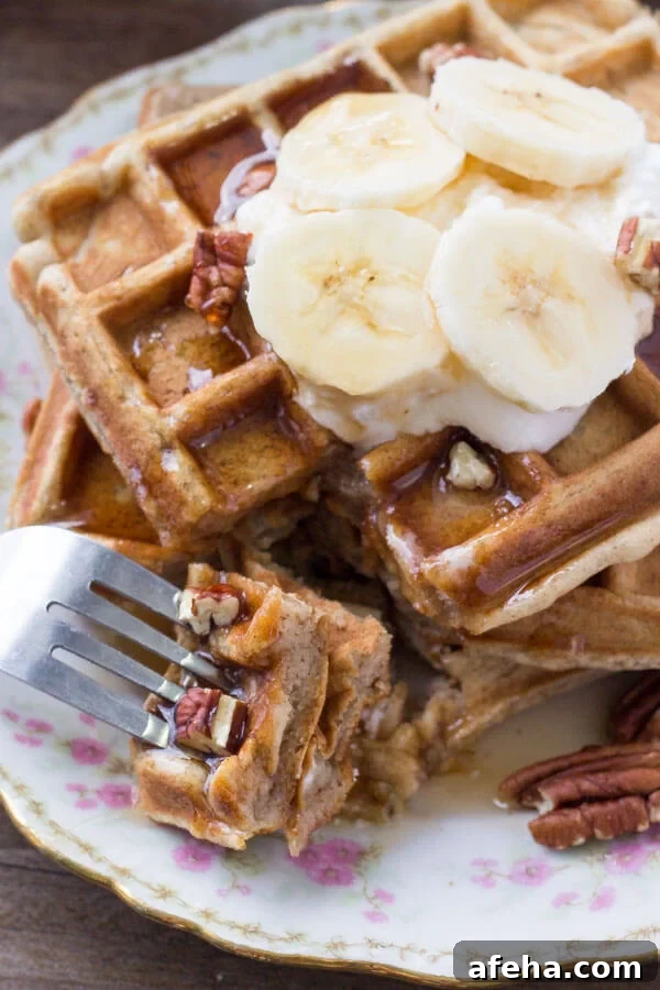 A bite of fluffy banana waffles. 