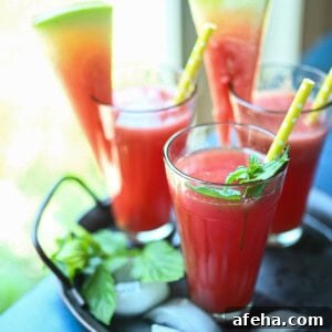 Three glasses of watermelon water by the window.