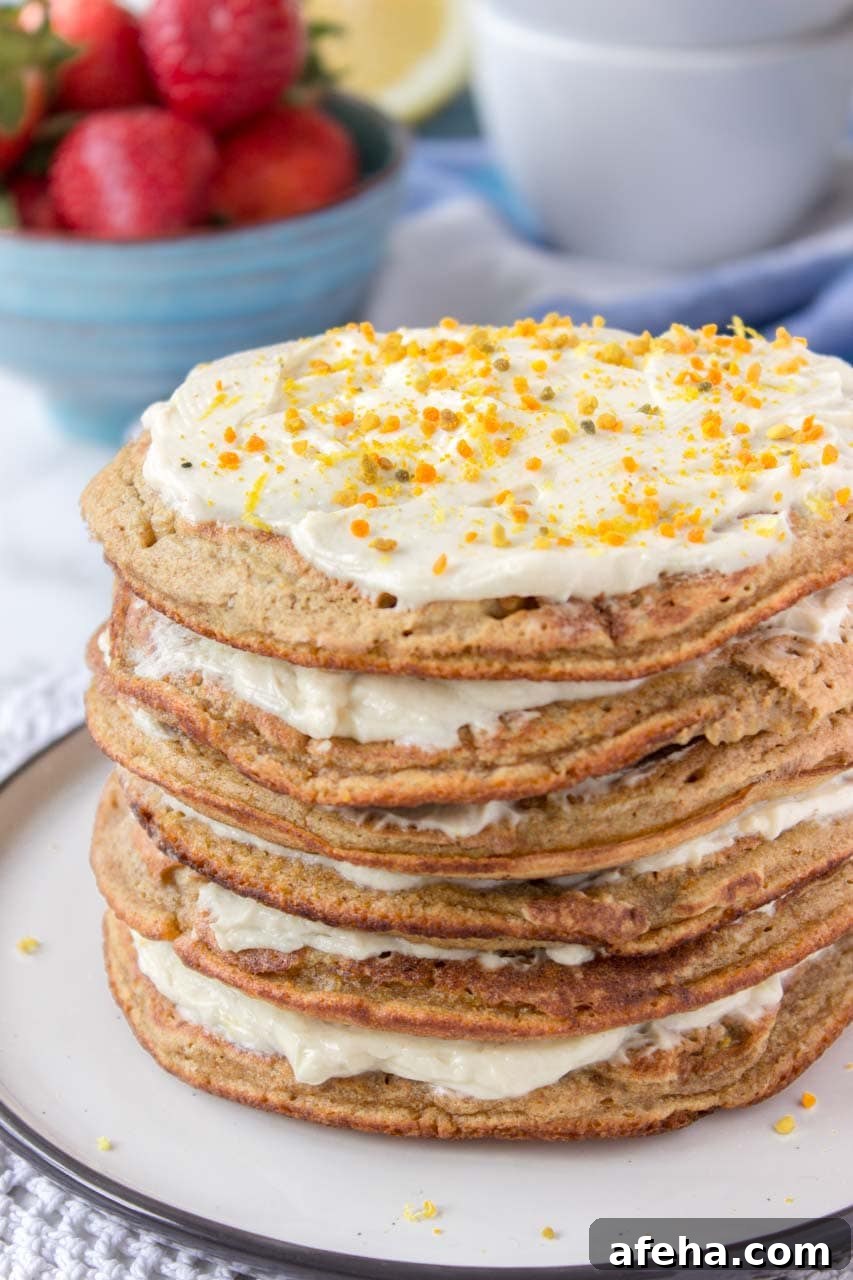 Whole grain healthy Lemon Cardamom Pancakes with cream cheese filling and strawberries