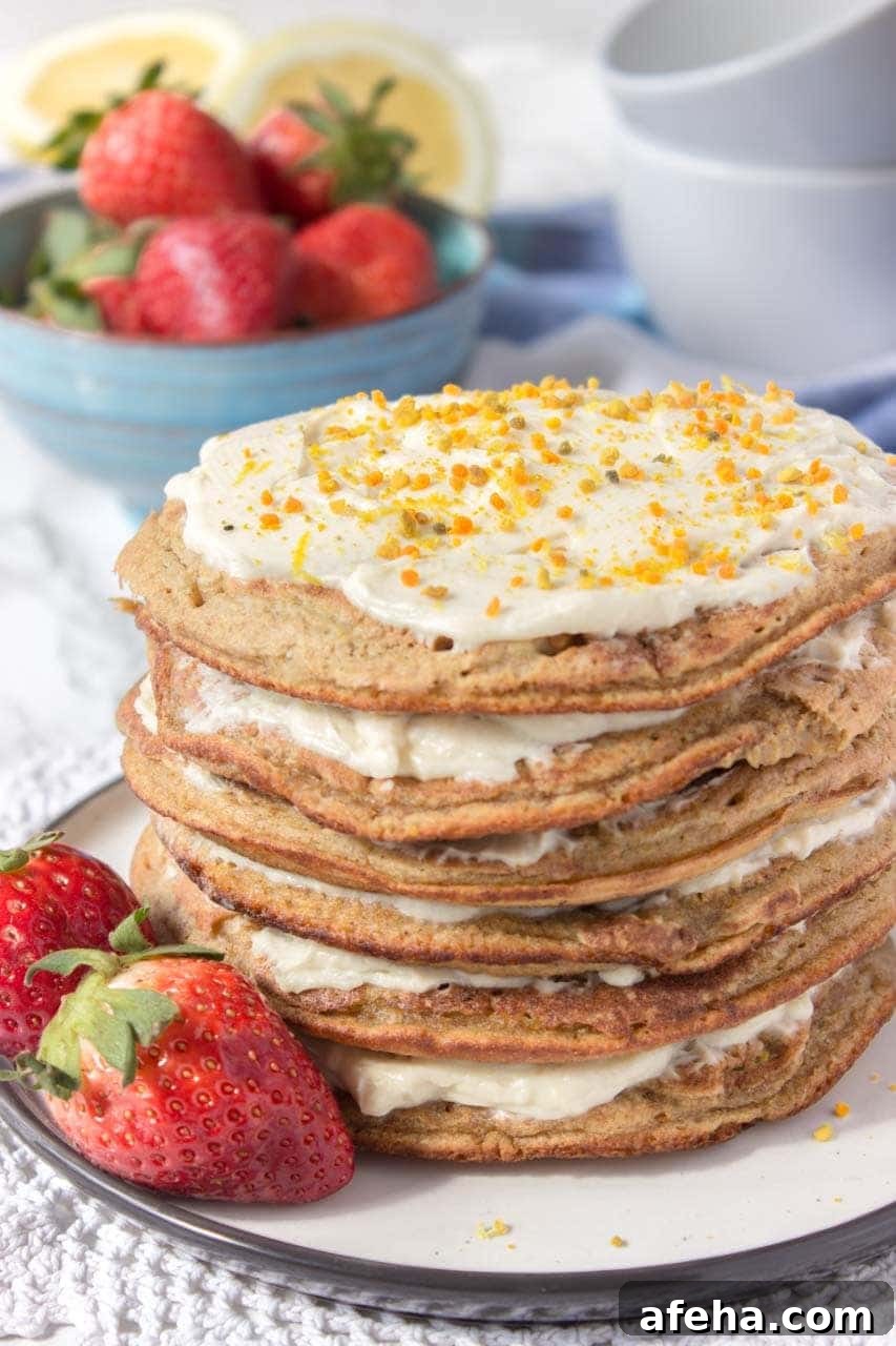Whole grain healthy Lemon Cardamom Pancakes with cream cheese filling and strawberries