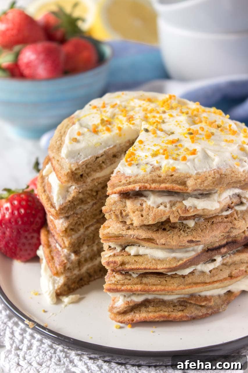 Whole grain healthy Lemon Cardamom Pancakes with cream cheese filling and strawberries