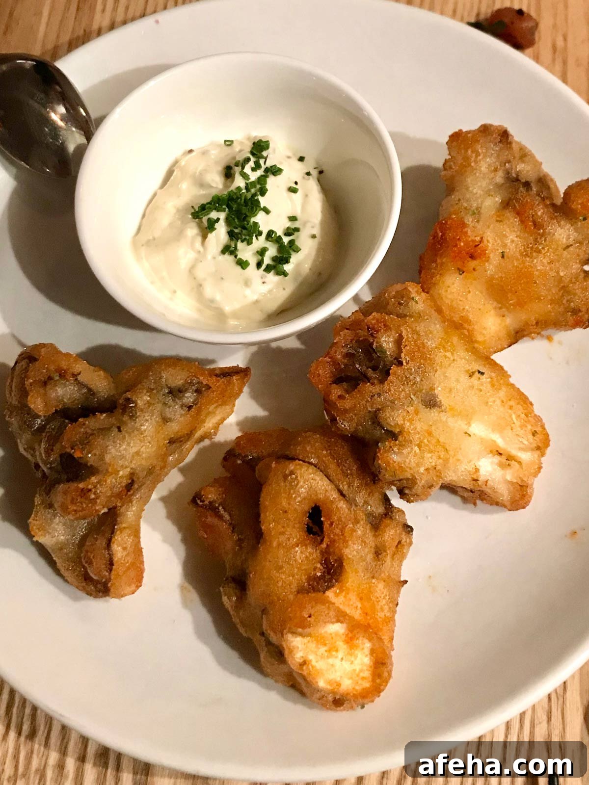plated of crispy maitake mushrooms and chive dip