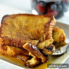 French toast on a plate with berries.