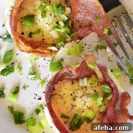 Bacon egg cups on a plate.