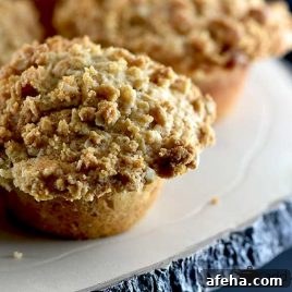 Cinnamon muffins on a cooling rack.
