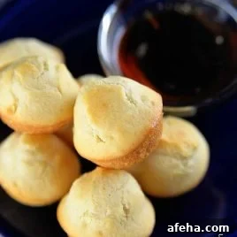 Plate of pancake muffins with syrup.