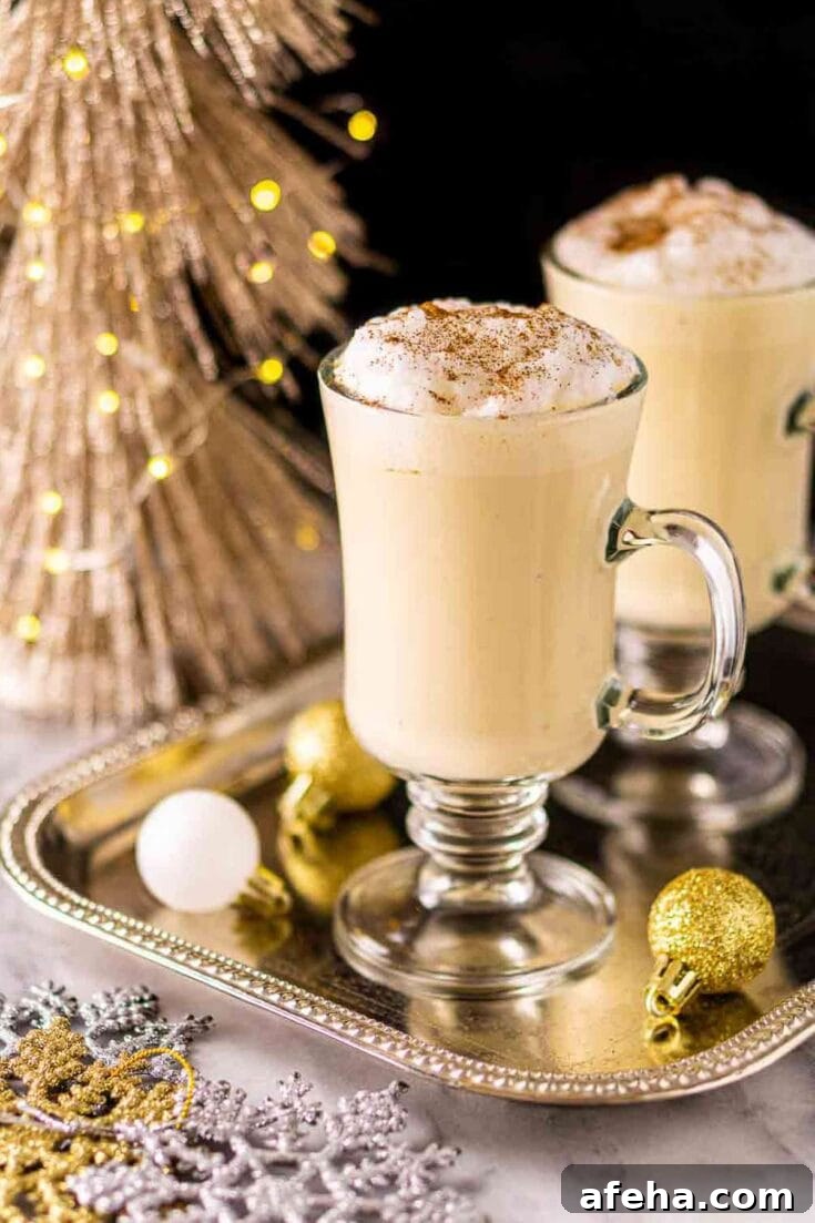 A Baileys eggnog cocktail sitting on a golden platter.